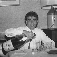 alboreto with a bottle of champagne